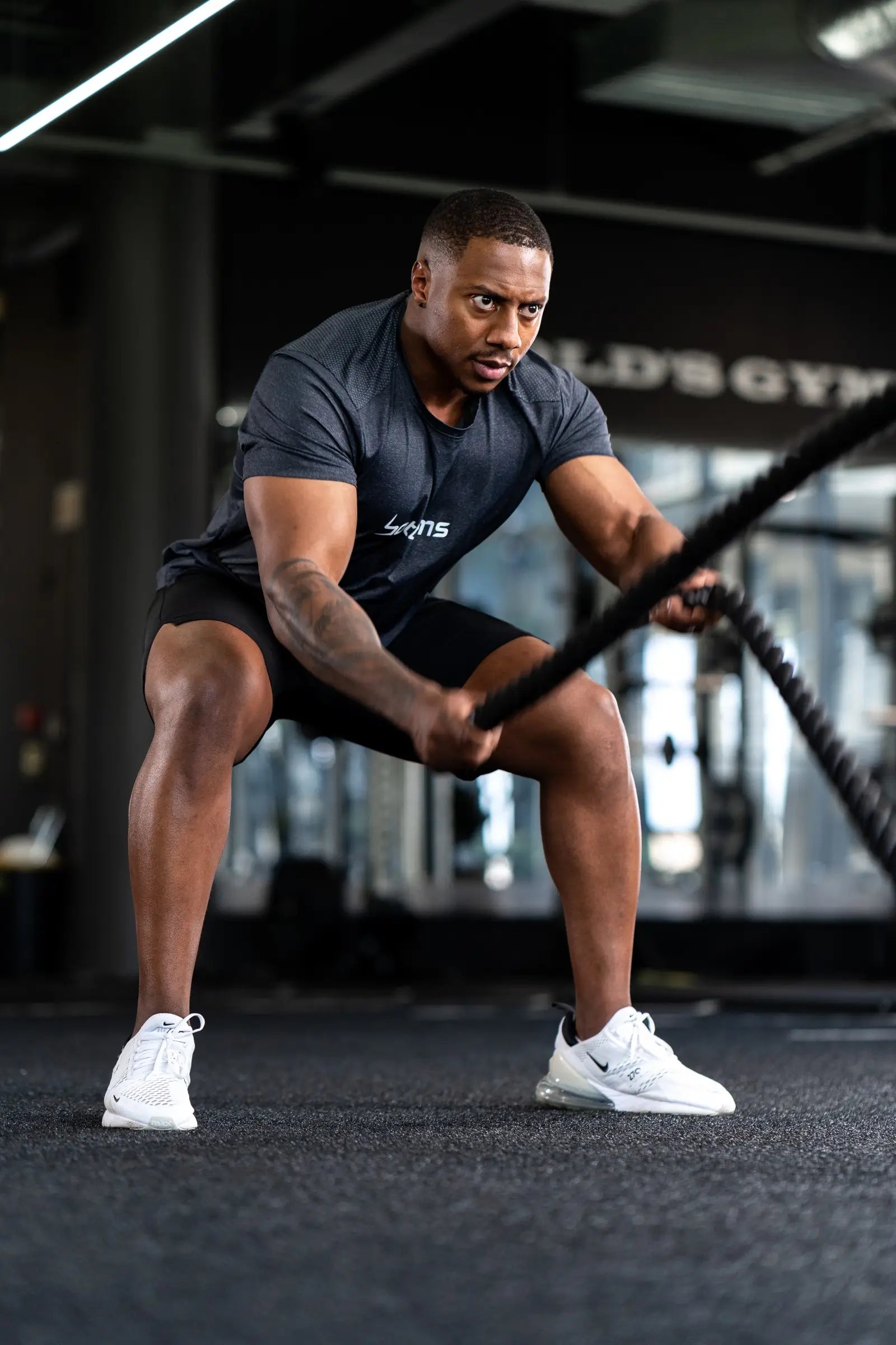 athlete wearing botthms black sport t-shirt during workout