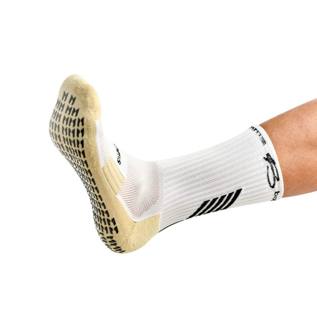A foot wearing botthms grip socks