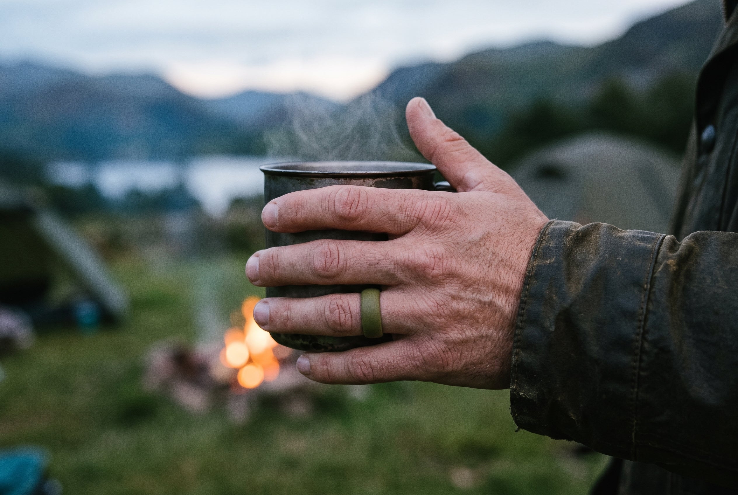 Olive camo men's silicone ring worn holding a steaming tin mug at a Lake District campsite