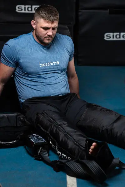 man trying on botthms leg compression recovery pump