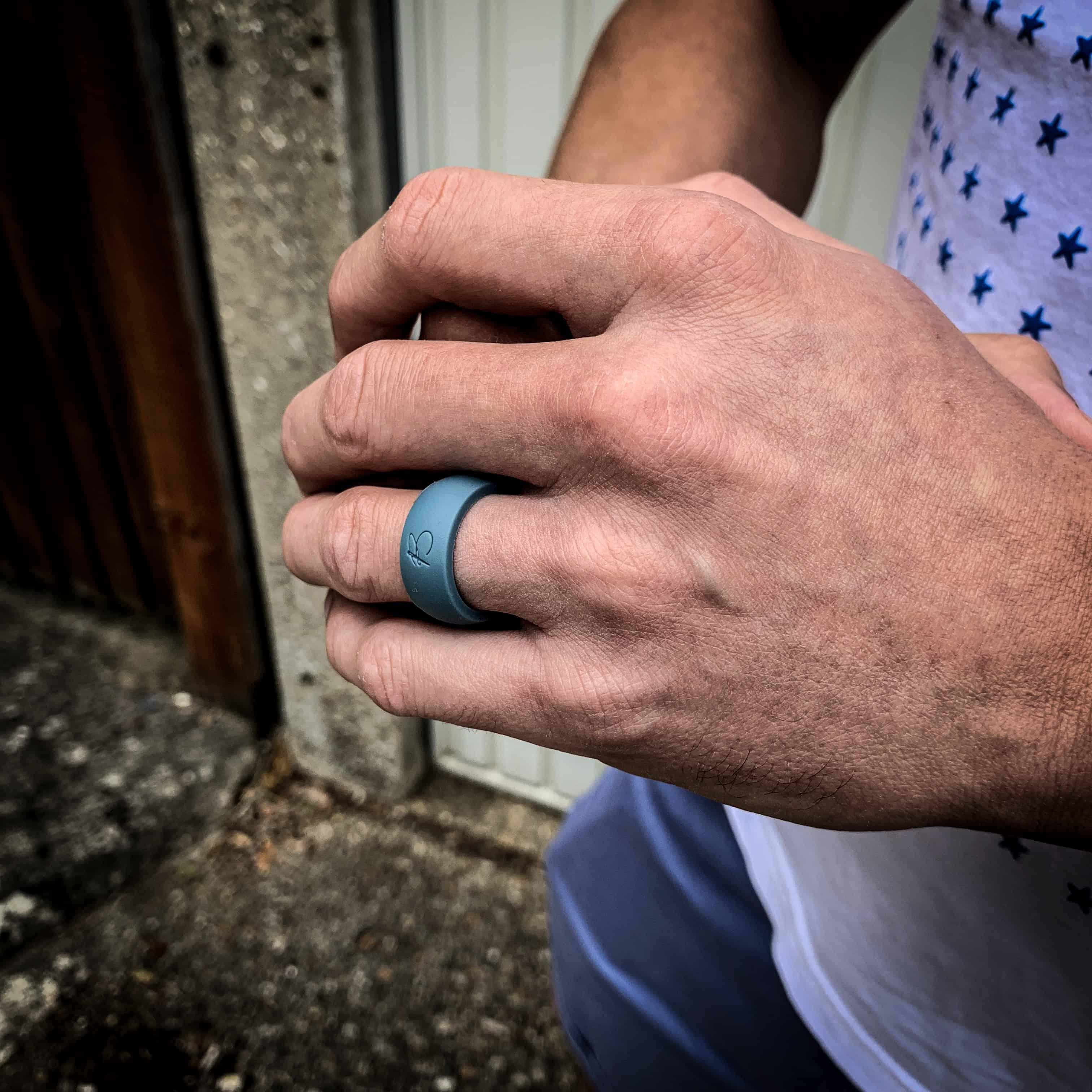 man wearing botthms teal blue active silicone ring