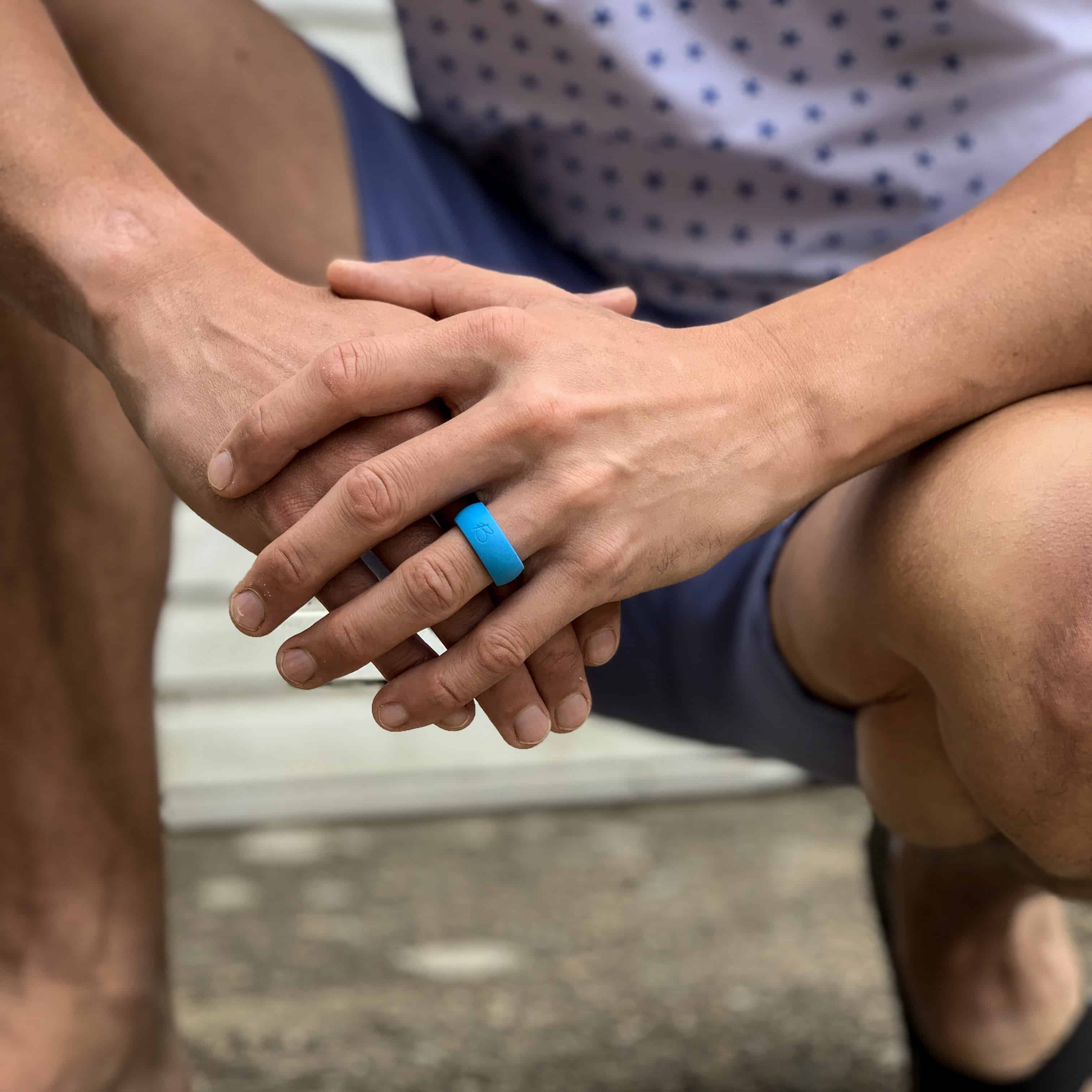 man wearing botthms turquoise active silicone ring