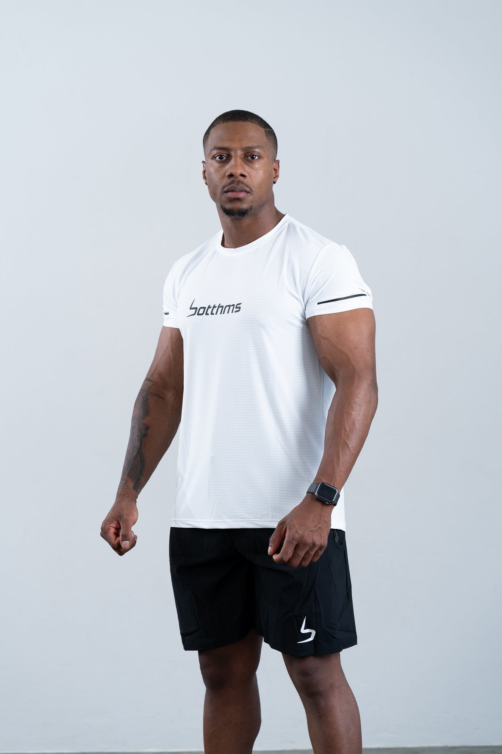 athlete wearing botthms white sport t-shirt - front left view and front facing