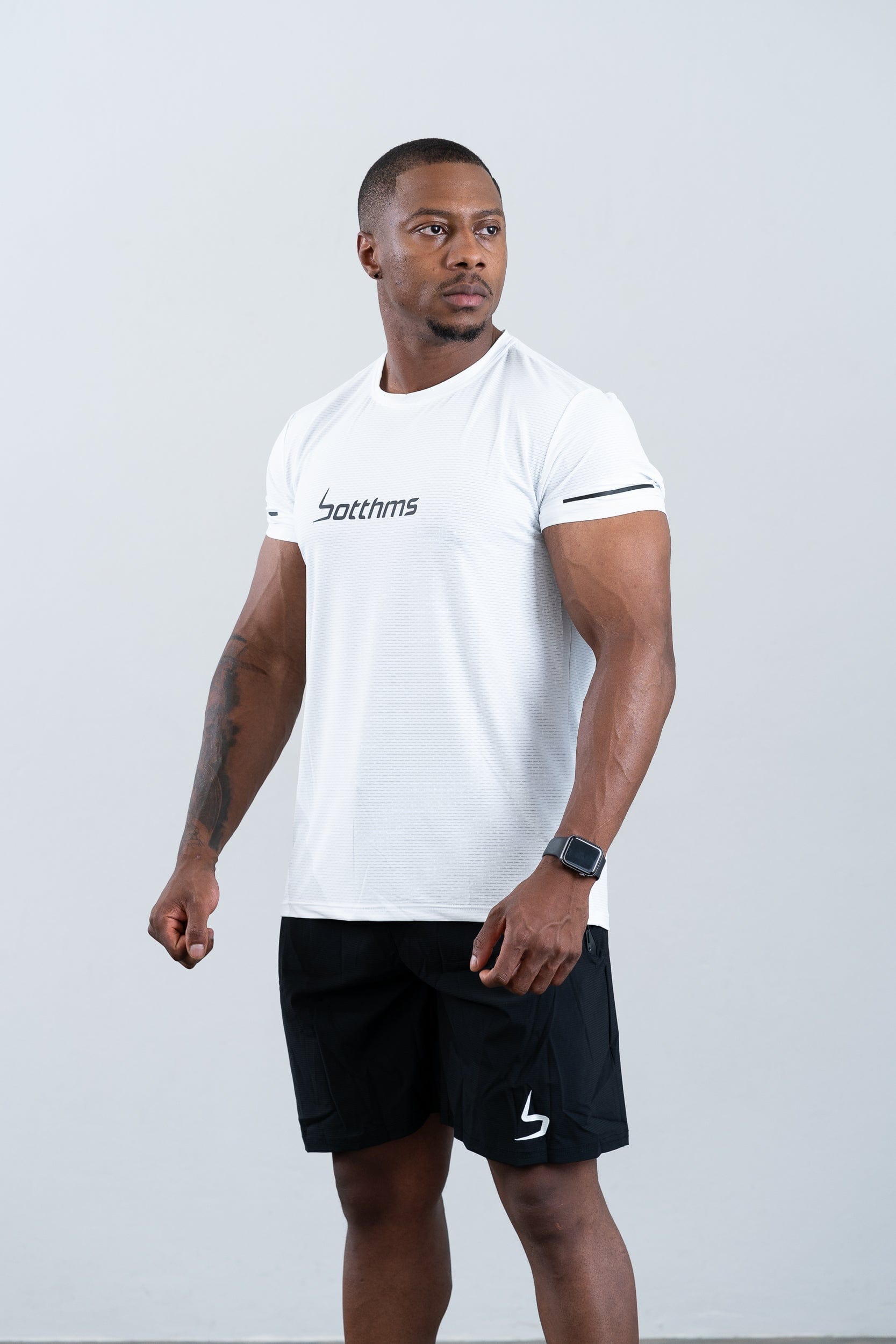 athlete wearing botthms white sport t-shirt - front left view