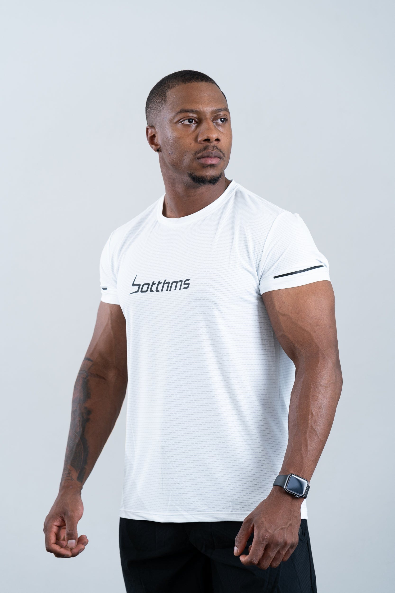 athlete wearing botthms white sport t-shirt - front left view