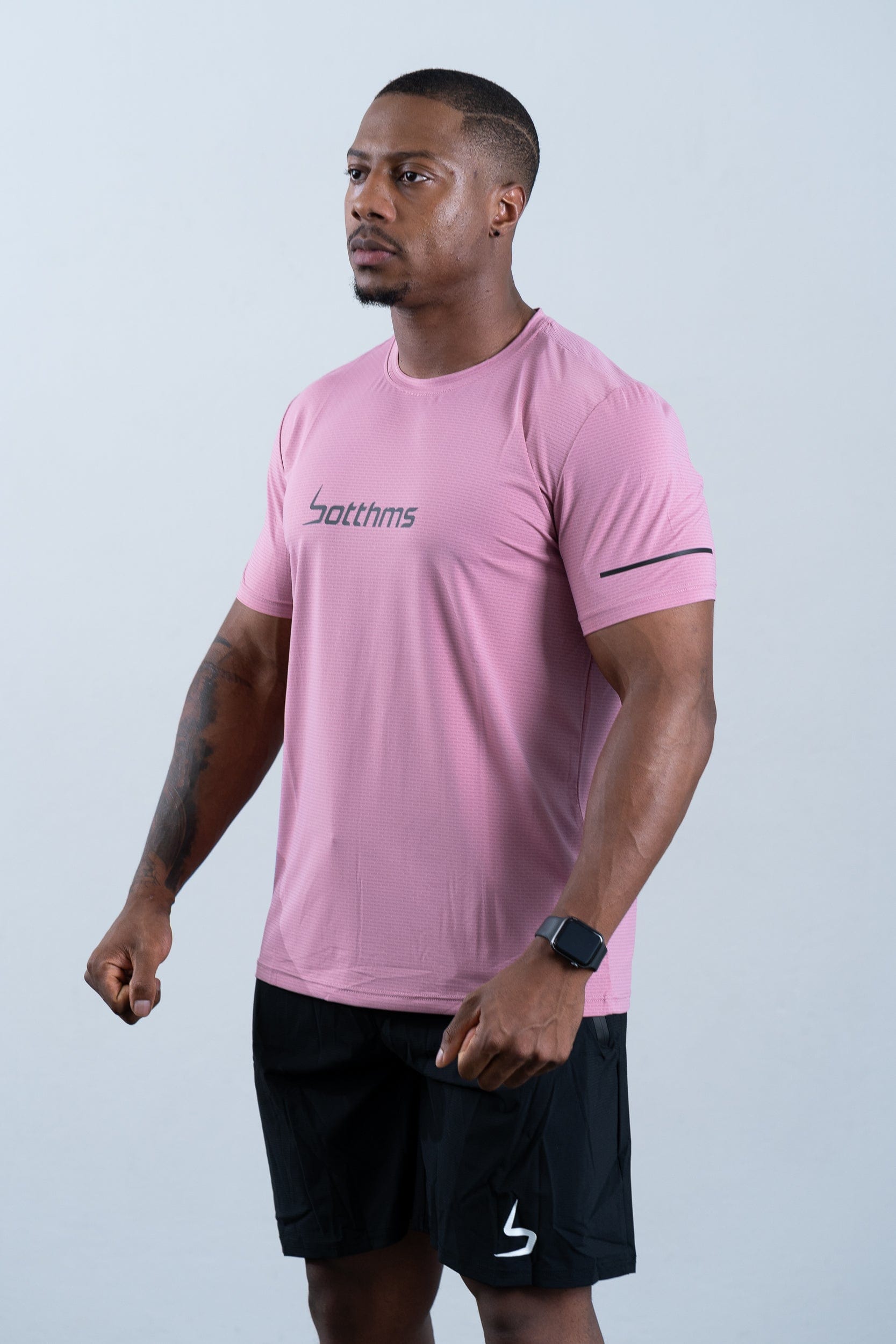 athlete wearing botthms pink sport t-shirt - front left view
