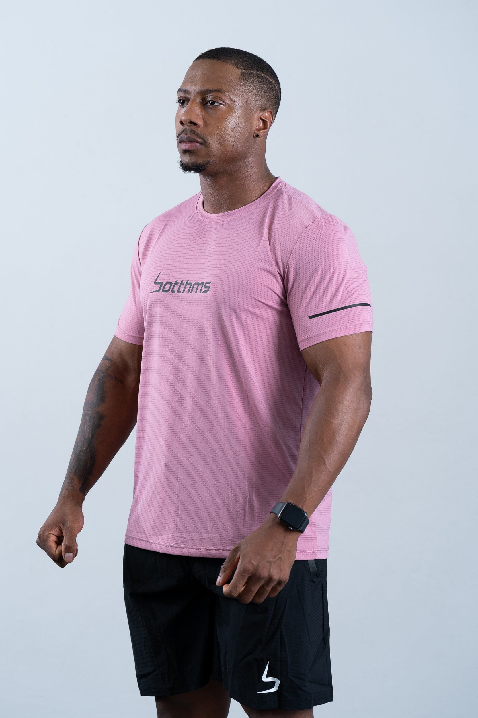 athlete wearing botthms pink sport t-shirt - front left view