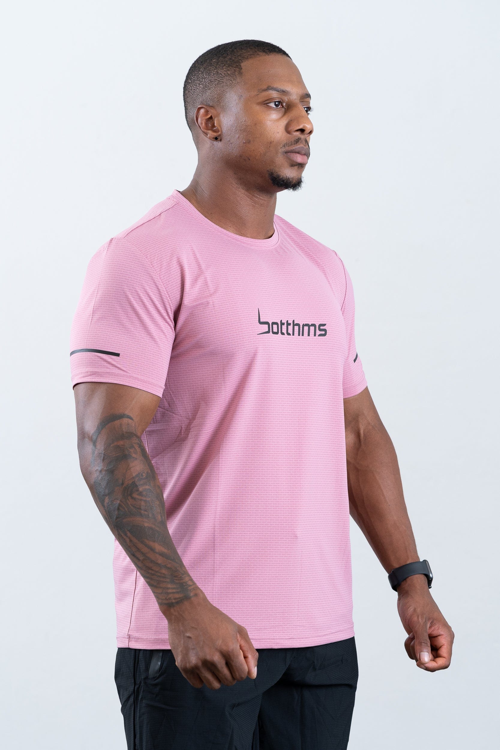 athlete wearing botthms pink sport t-shirt- right front view