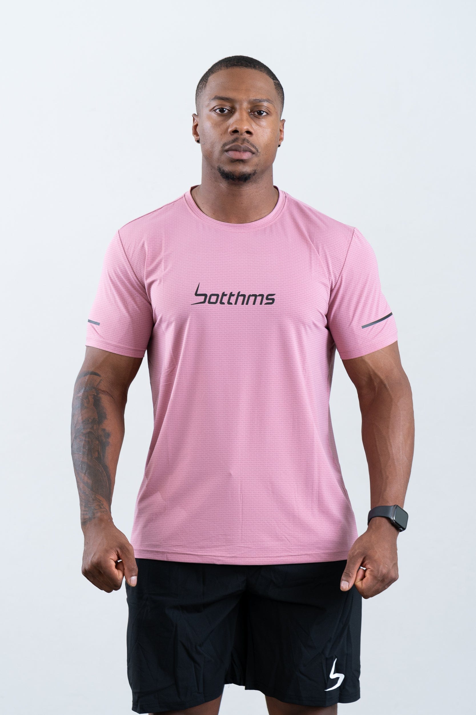 athlete wearing botthms pink sport t-shirt- front view