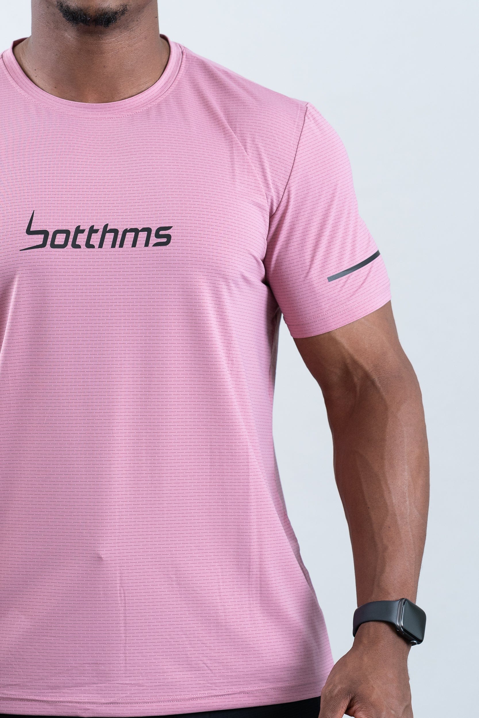 athlete wearing botthms pink sport t-shirt- front closeup view