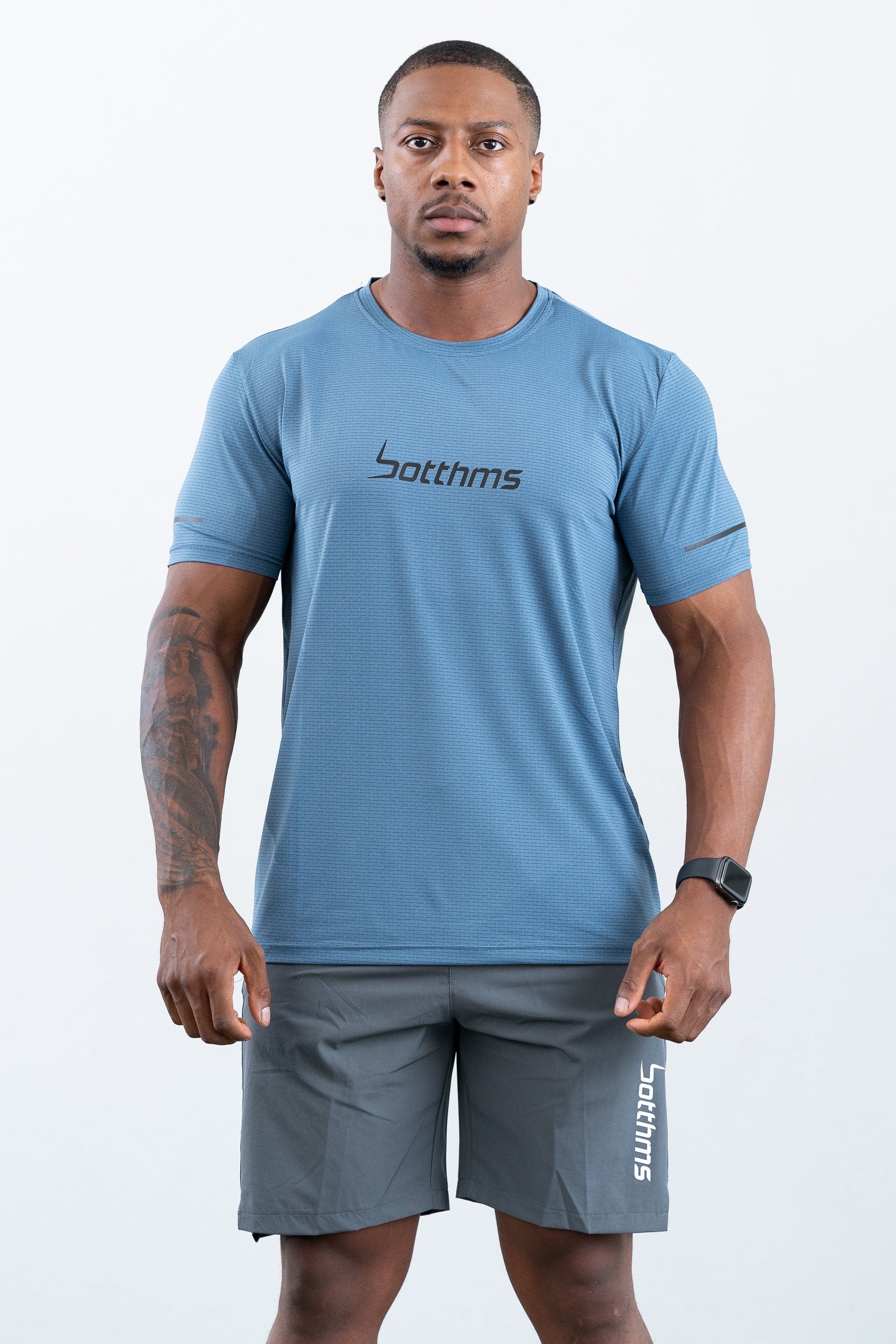 athlete wearing botthms blue sport t-shirt- front view