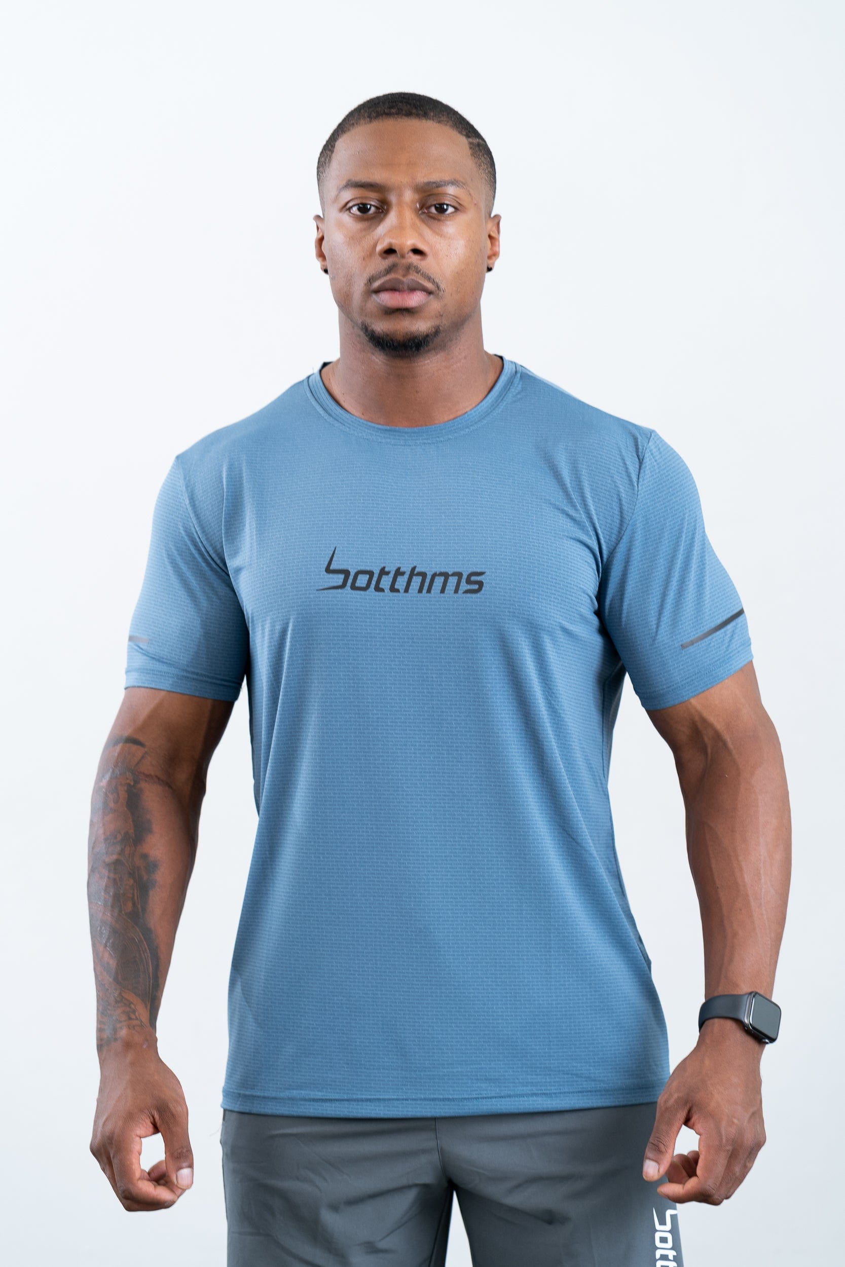 athlete wearing botthms blue sport t-shirt- front view full