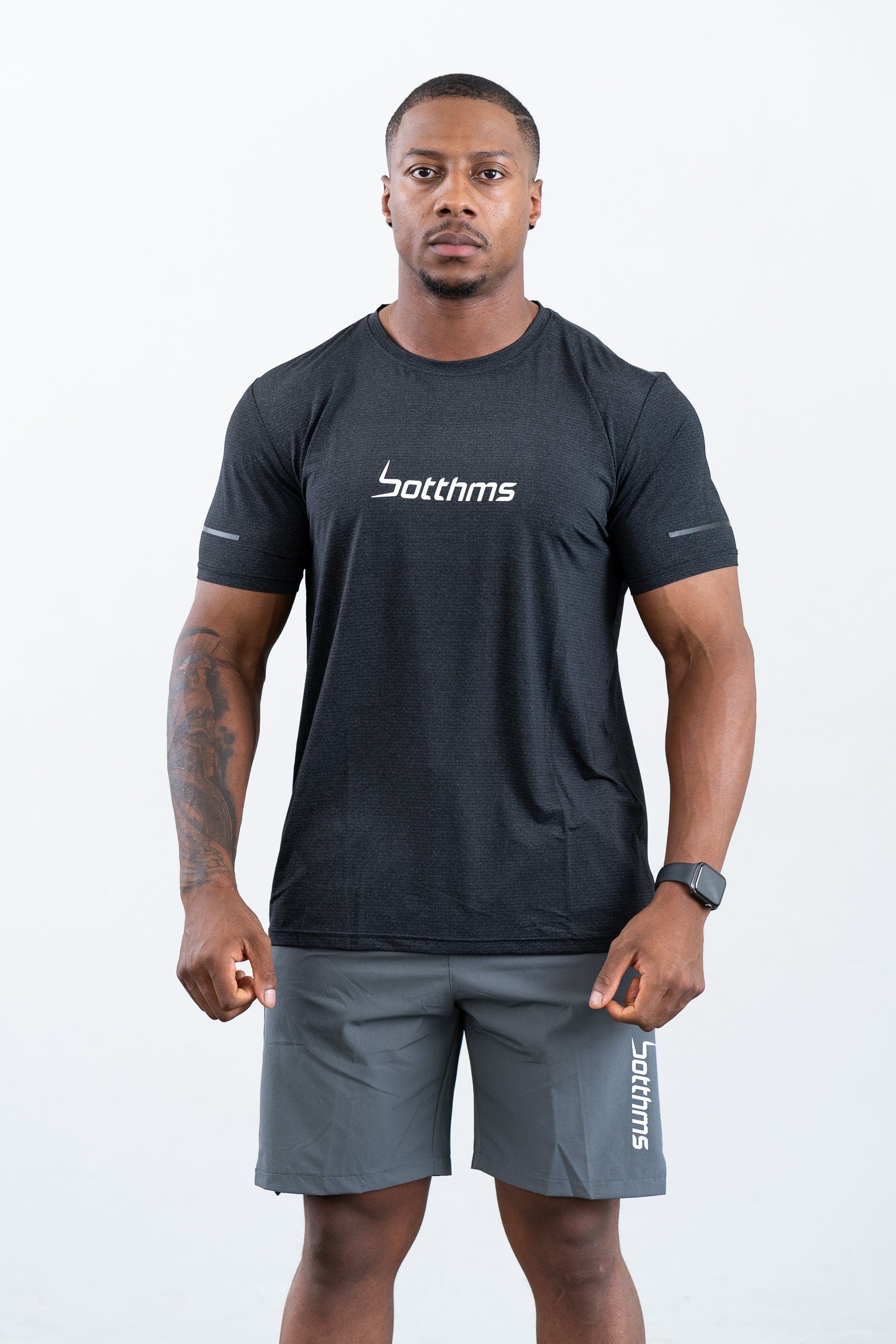 man standing wearing botthms black sport t-shirt- front face view